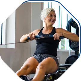Woman Smiling During the Workout at HiTONE Fitness