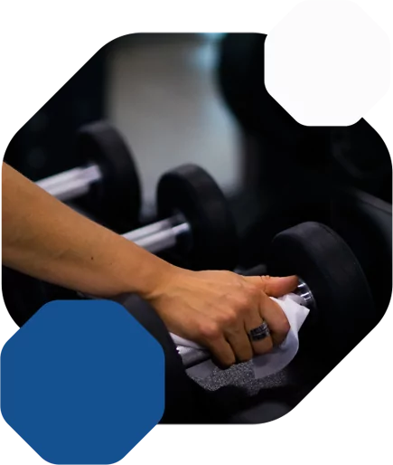 HiTONE Fitness Employee Cleaning the Weights