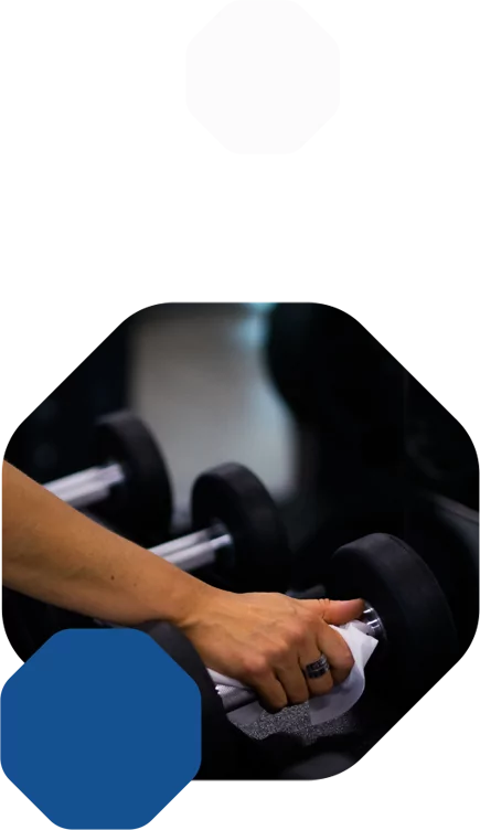 HiTONE Fitness Employee Cleaning the Weights