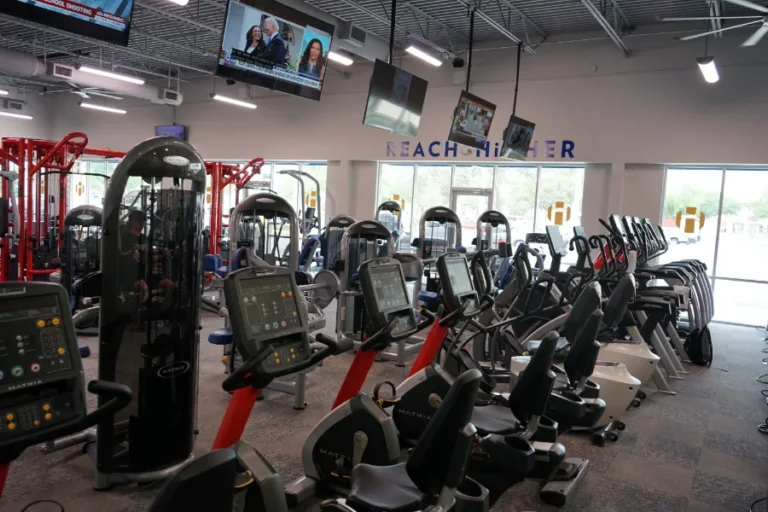 different kinds of gym equipment in a room.