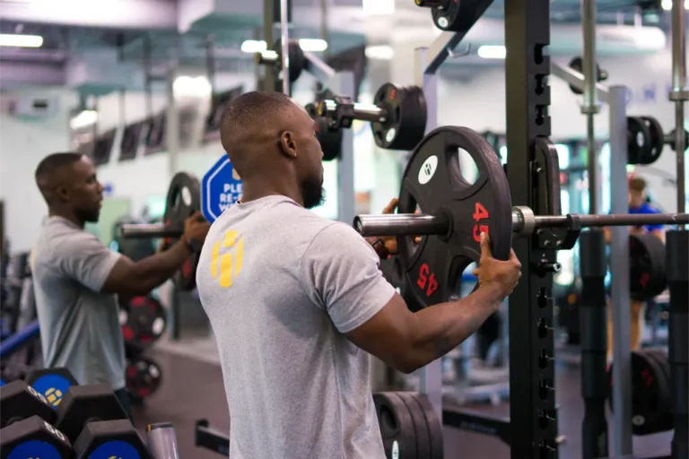 a man preparing weights for a workout.