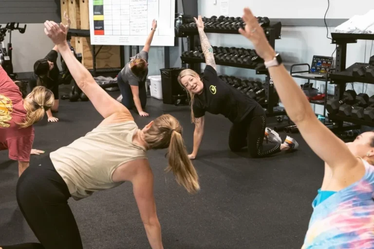 Multiple Women stretching on the floor.