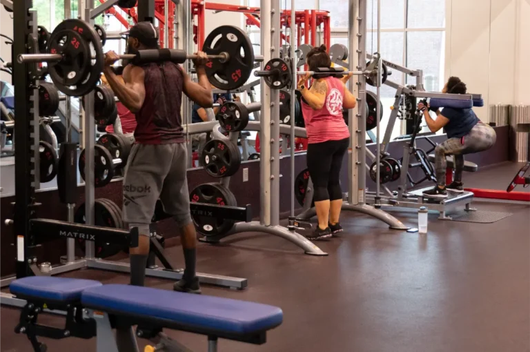 3 People working out their glutes and lower back.