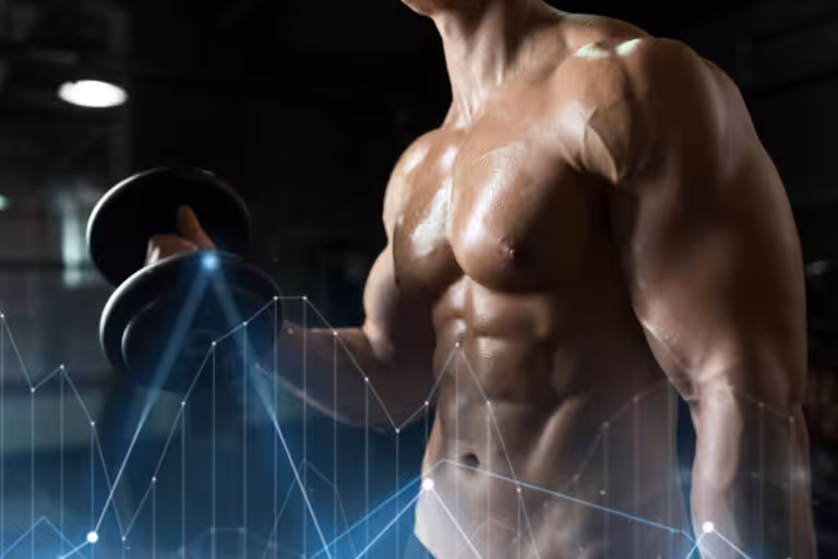 Muscular person lifting dumbbell in gym.