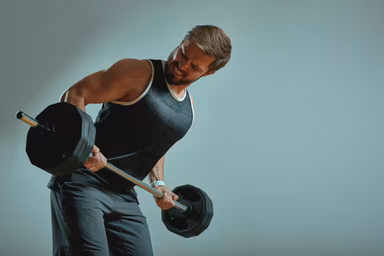 Man lifting dumbbells in gym workout.