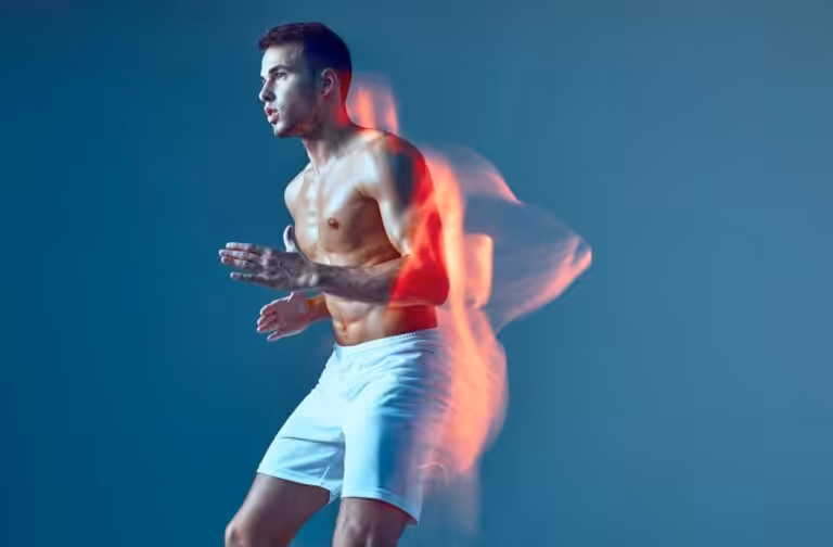 Athletic man running with motion blur effect.