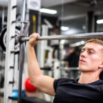 Man lifting weights in gym