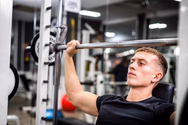 Man lifting weights in gym