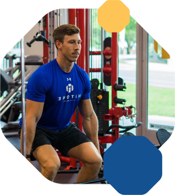Man lifting weights at gym.