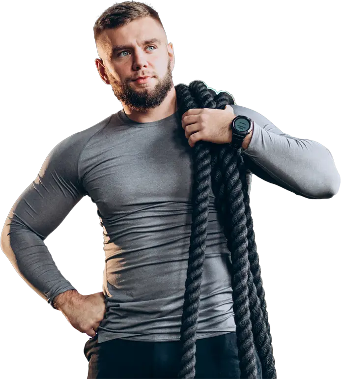 Man holding exercise rope in gym attire